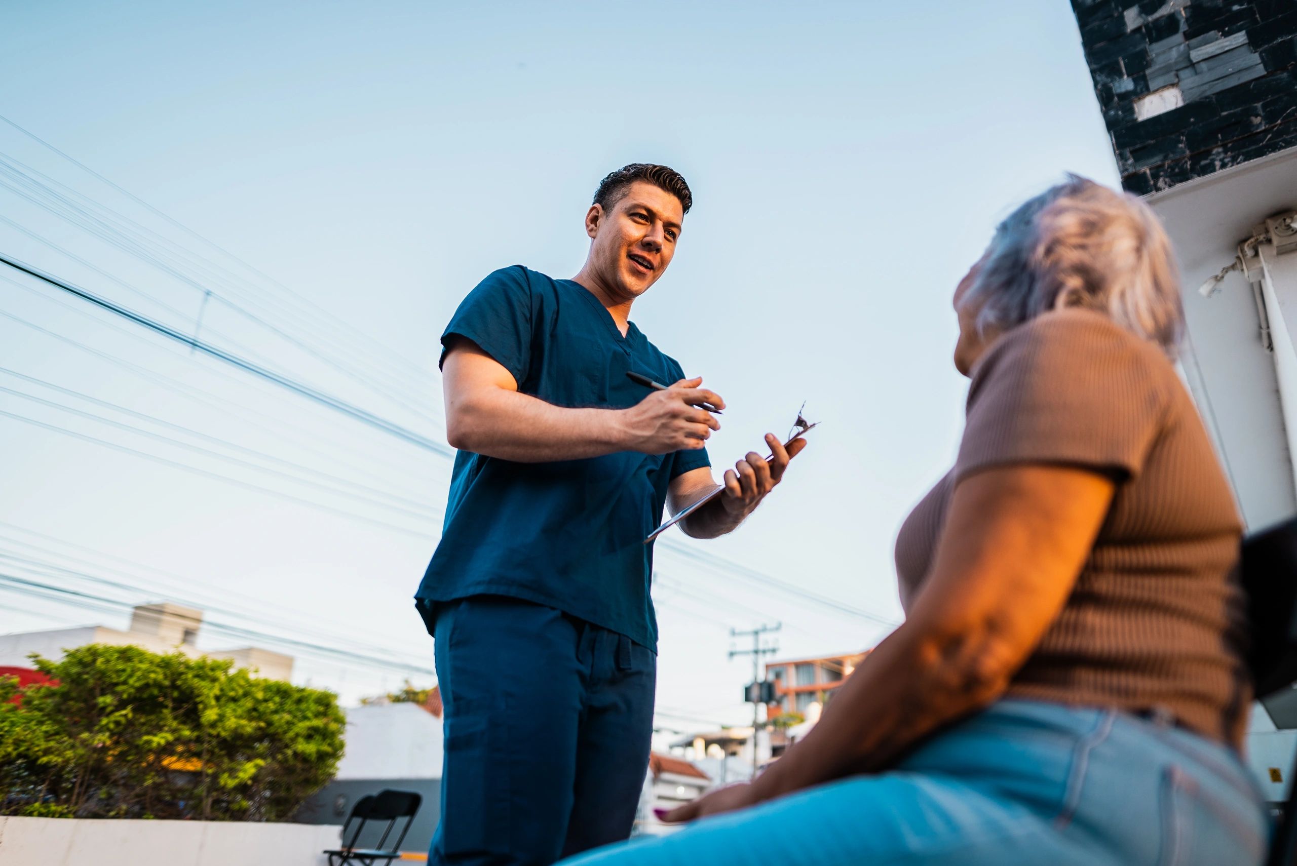 Healthcare professional speaking with a patient